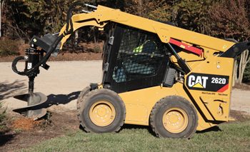 Cat skid steer with post-hole auger