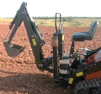 Ditch Witch stand-on skid steer backhoe attachment
