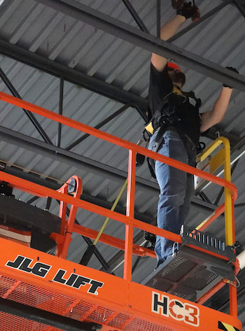 JLG mid-deck step attachment