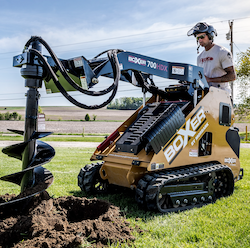 Boxer mini skid steer with auger attachment